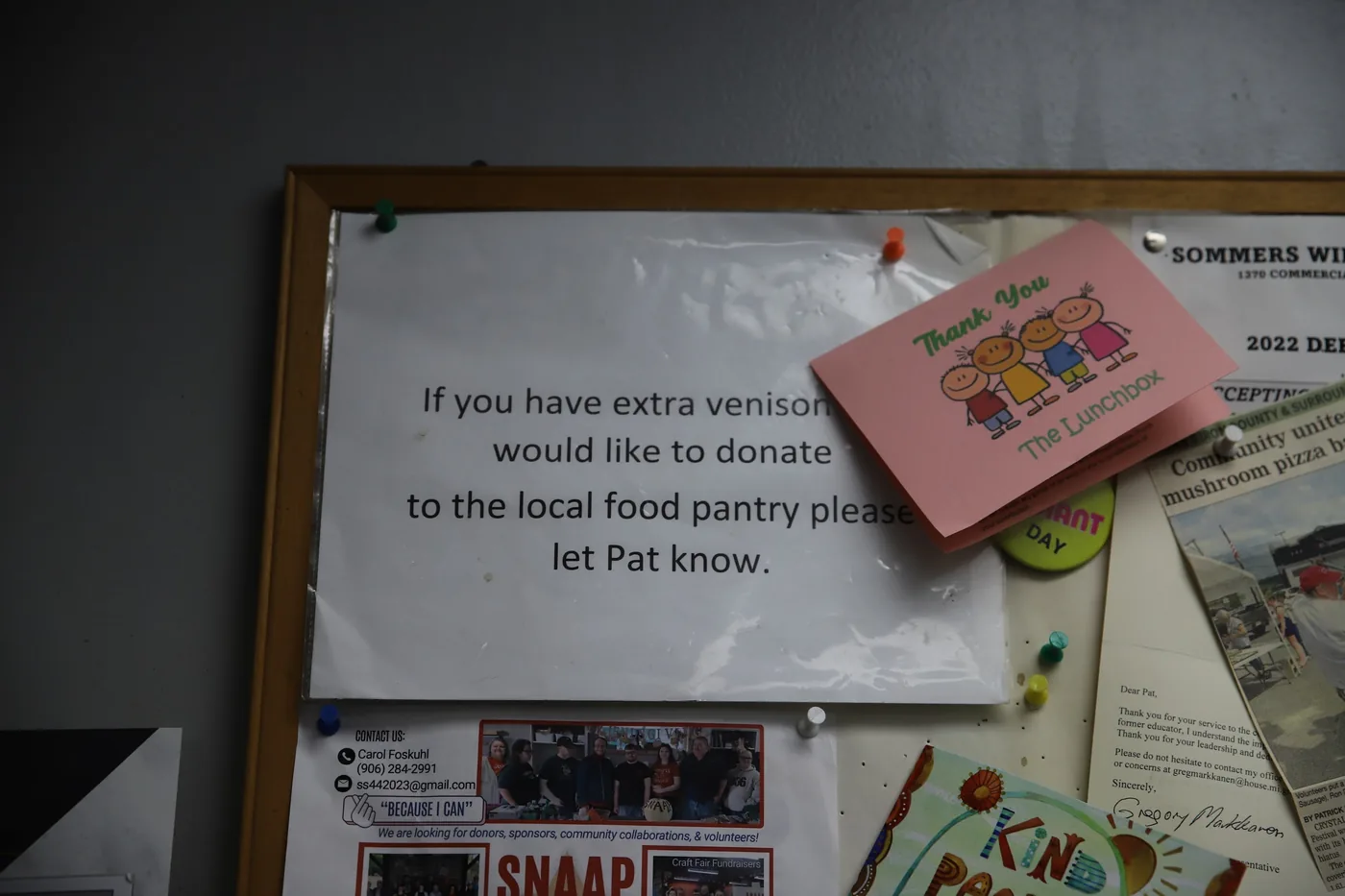 Community bulletin board at the shop with a venison donation notice